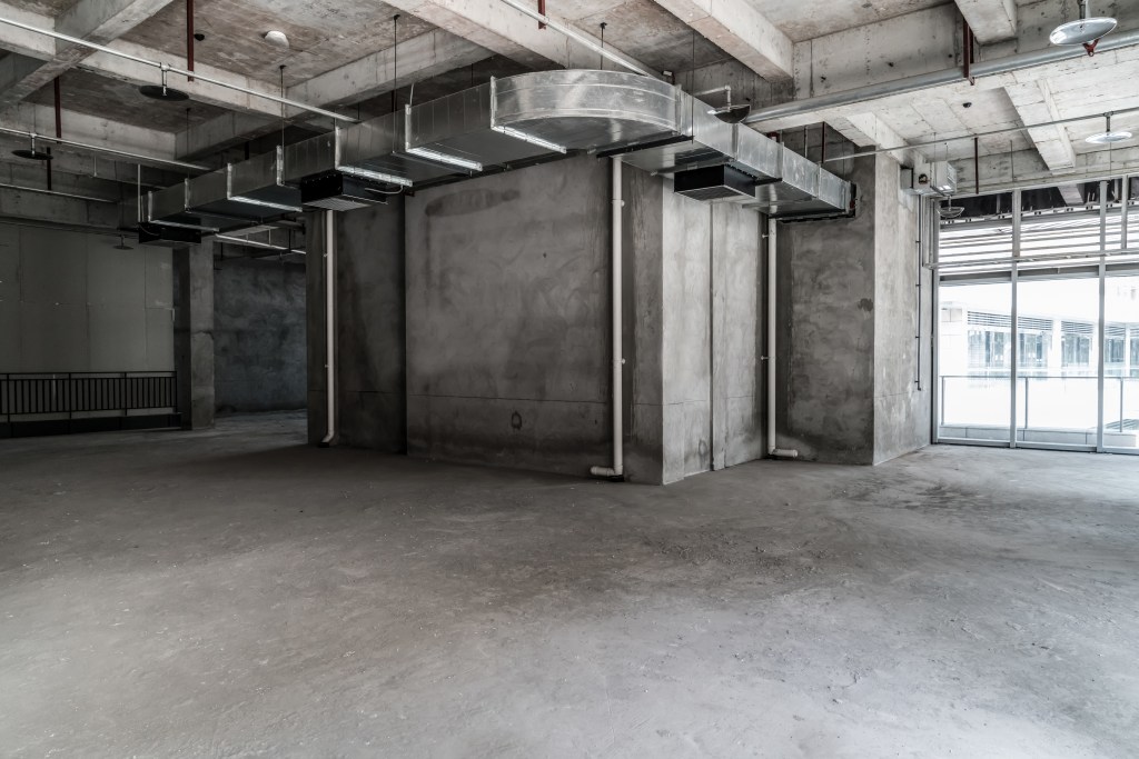 Commercial interior space with natural lighting and modern finishes ready for tenant improvement construction